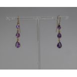 A Pair of Amethyst and Gold Coloured Metal Drop Earrings, Each with Three Graduated Teardrop
