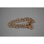 An Antique Rose Gold Coloured Metal (Tests as 9ct) Charm Bracelet. Unusual Large Circular Links to a
