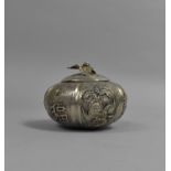 A Chinese White Metal Lidded Pot of Squat Gourd Form decorated with Lobed Panels Incorporating