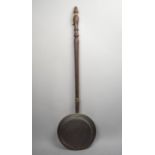 A Vintage Copper Bed Warming Pan with Turned Wooden Handle