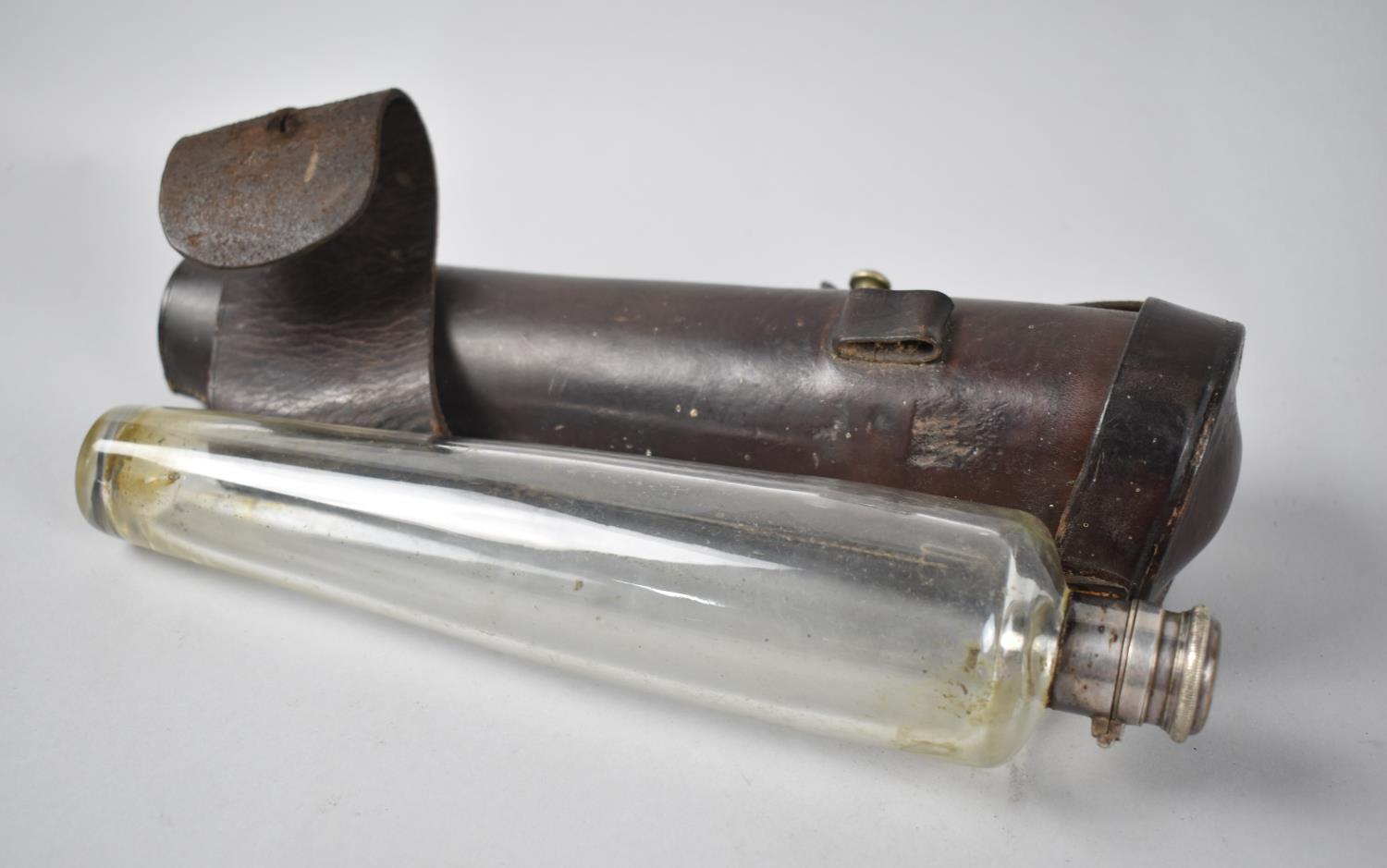 A Vintage Leather Cased Glass Saddle Flask, 25cms Long