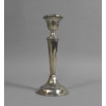 A Silver Candlestick, 18.5cm high, has been Soldered to Base