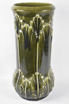 A Continental Green Majolica Glazed Stick Stand with Acanthus Moulded Decoration, 57cms High