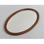 An Edwardian Inlaid Mahogany Oval Wall Mirror, 22cm wide