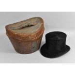 A Leather Cased Moleskin Top Hat, Case in Distressed Condition