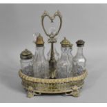 An Early 20th Century Seven Bottle Cruet, with Scrolled Feet, 26cms High