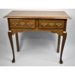 A Reproduction Oak Two Drawer Side Table on Extended Cabriole Supports, 86cms Wide