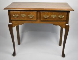 A Reproduction Oak Two Drawer Side Table on Extended Cabriole Supports, 86cms Wide