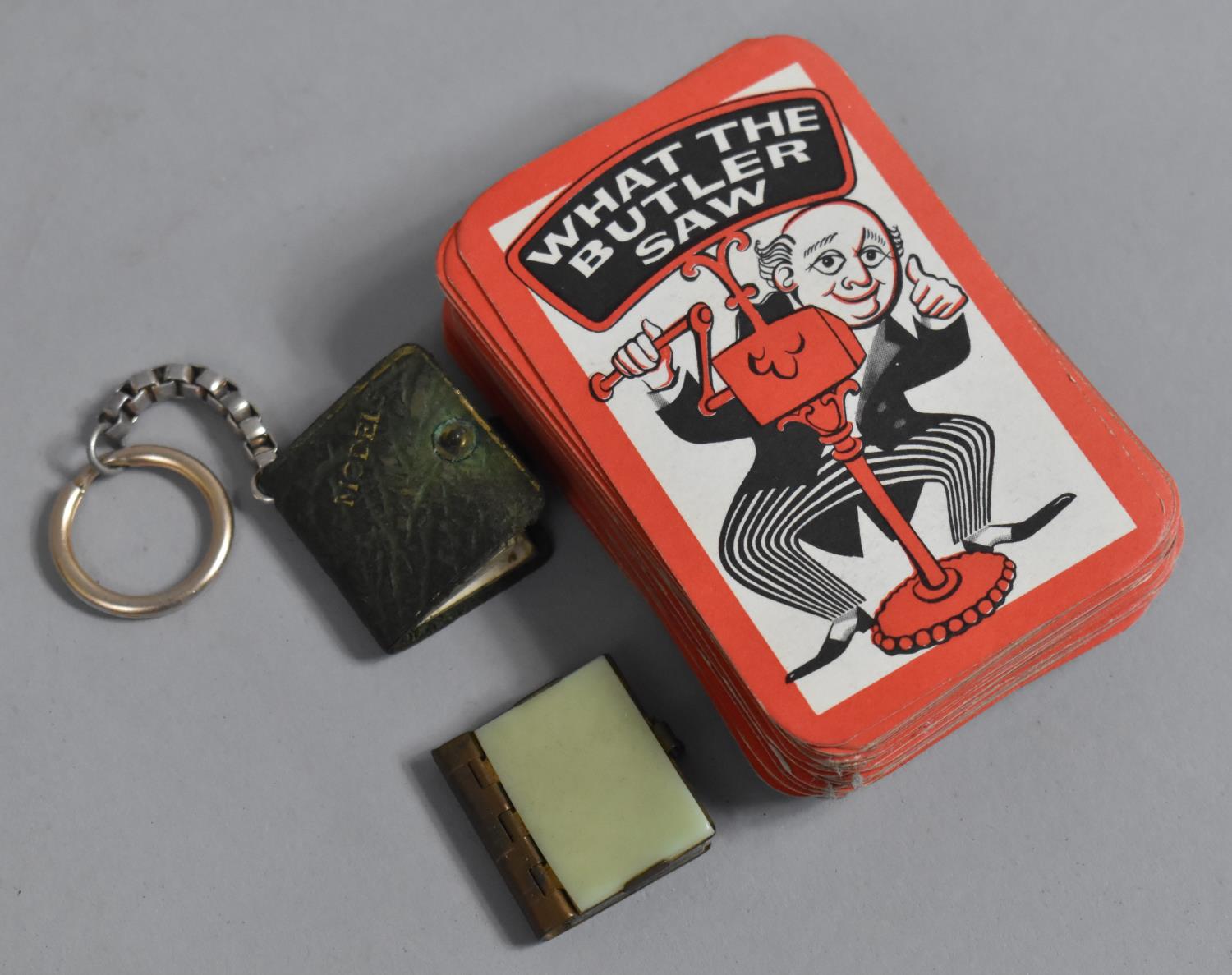 A Pack of What Butler Saw Playing Cards together with two Vintage Novelty Keyring Books containing - Image 2 of 2