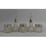 A Collection of Silver Topped Glass Dressing Table Bottles