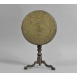 A 19th Century Brass Candle Reflector in the Form of a Circular Snap Top Tripod table, 24cms High