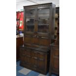 A Mid 20th Century Ercol Oak Bookcase with Pulled Down Cocktail Section to Centre, 98cm wide