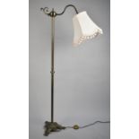 A Modern Standard Lamp and Shade, with Reeded Brass Support and Tripod Scrolled Base