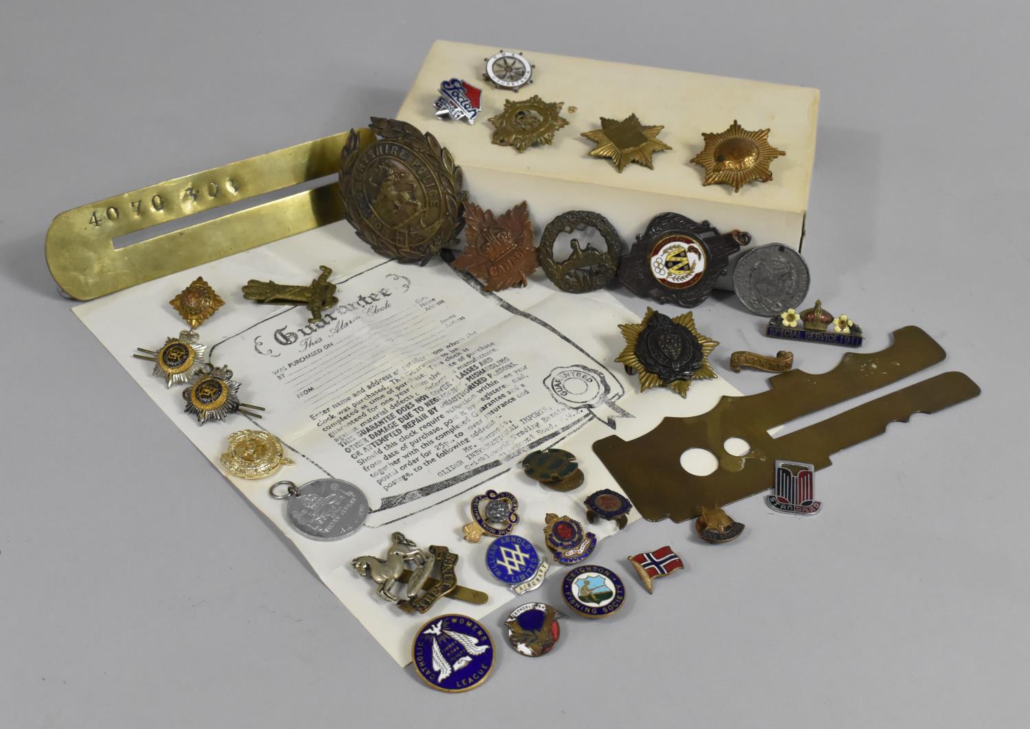 A Collection of Various Military Badges, Enamelled Lapel Badges, Brass Button Cleaning Guards etc