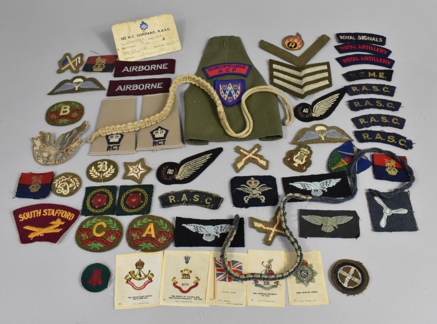 A Large Collection of Cloth Military Uniform Badges etc