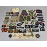 A Large Collection of Cloth Military Uniform Badges etc