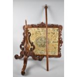 A Georgian Pole Screen with Silk Embroidered Panel in Carved and Pierced Frame, 51cms by 44cms on