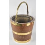 A Mid 20th Century Brass Banded Wooden Coal Bucket with Brass Inner Liner, 32cms Diameter