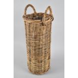 A Cylindrical Wicker Stick Stand with Two Carrying Handles, 24cms Diameter and 60cms High