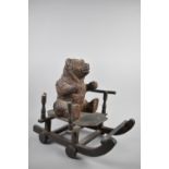 A Vintage Black Forest Carved Wooden Pull Along Toy in the Form of a Seated Bear Cub on Sledge,