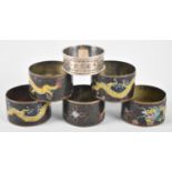 A Set of Five Oriental Cloisonne Enamelled Napkin Rings together with a Silver Example