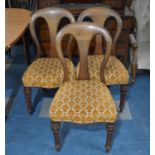 A Set of Three Late Victorian Balloon Back Mahogany Dining Chairs