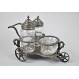 A 19th Century Britannia Metal Wheeled Cruet Chariot with Glass Containers, Pram Handle and on Three