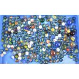 A Collection of Vintage and Modern Glass Marbles of Various Sizes