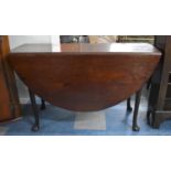 A Circular Topped Mahogany Drop Leaf Dining Table, 122cm Diameter