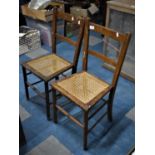 A Pair of Vintage Cane Seated Side Chairs