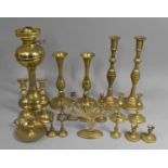 A Collection of Various Brass Candlesticks, Menorah, together with an Oil Lamp Base of Reeded Column