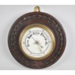 An Edwardian Aneroid Barometer with Carved Oak Wall Hanging Plinth, 24cms Diameter