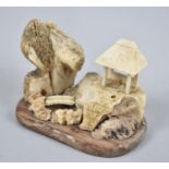 A Carved Oriental Bone Diorama, 8cms Wide