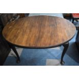 An Oval Mahogany Extending Dining Table, 131cm Long