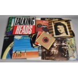 A Collection of 33rpm and 45rpm Records to Include Meatloaf, Led Zeppelin, Talking Heads, Eric