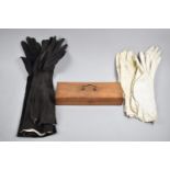 An Edwardian Oak Glove Box together with Four Pairs of Kid Gloves