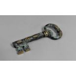A Modern Novelty Corkscrew in the form of a Large Brass Door Key with Green Verdigris Decoration,