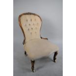 A Victorian Style Balloon Back Nursing Chair with Buttoned Upholstery