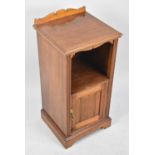 An Edwardian Galleried Bedside Cabinet with Panelled Door to Base Section, 38cms Wide and 80cms High