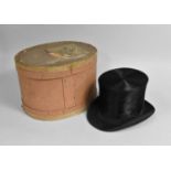 A Silk Top Hat by Haywood & Sons, Size 6 3/4 in Oval Cardboard Hatbox