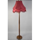 A Mid 20th Century Turned Standard Lamp and Shade