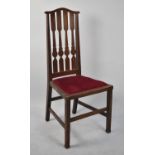 An Edwardian Oak High Backed Hall Chair