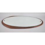 A 1970's Wall Hanging Oval Mirror on Mahogany Backplate, 74x28cm