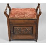 An Edwardian Lift Top Piano Stool with Carved Panel Door to Base Shelved Store, 57cm Wide