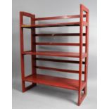 A Mid 20th Century Red Painted Wooden Folding Three Shelf Unit, 70cms Wide