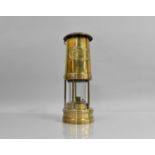 A Solid Brass Miner's Safety Lamp by Thomas and Williams, Aberdare, 25cms High