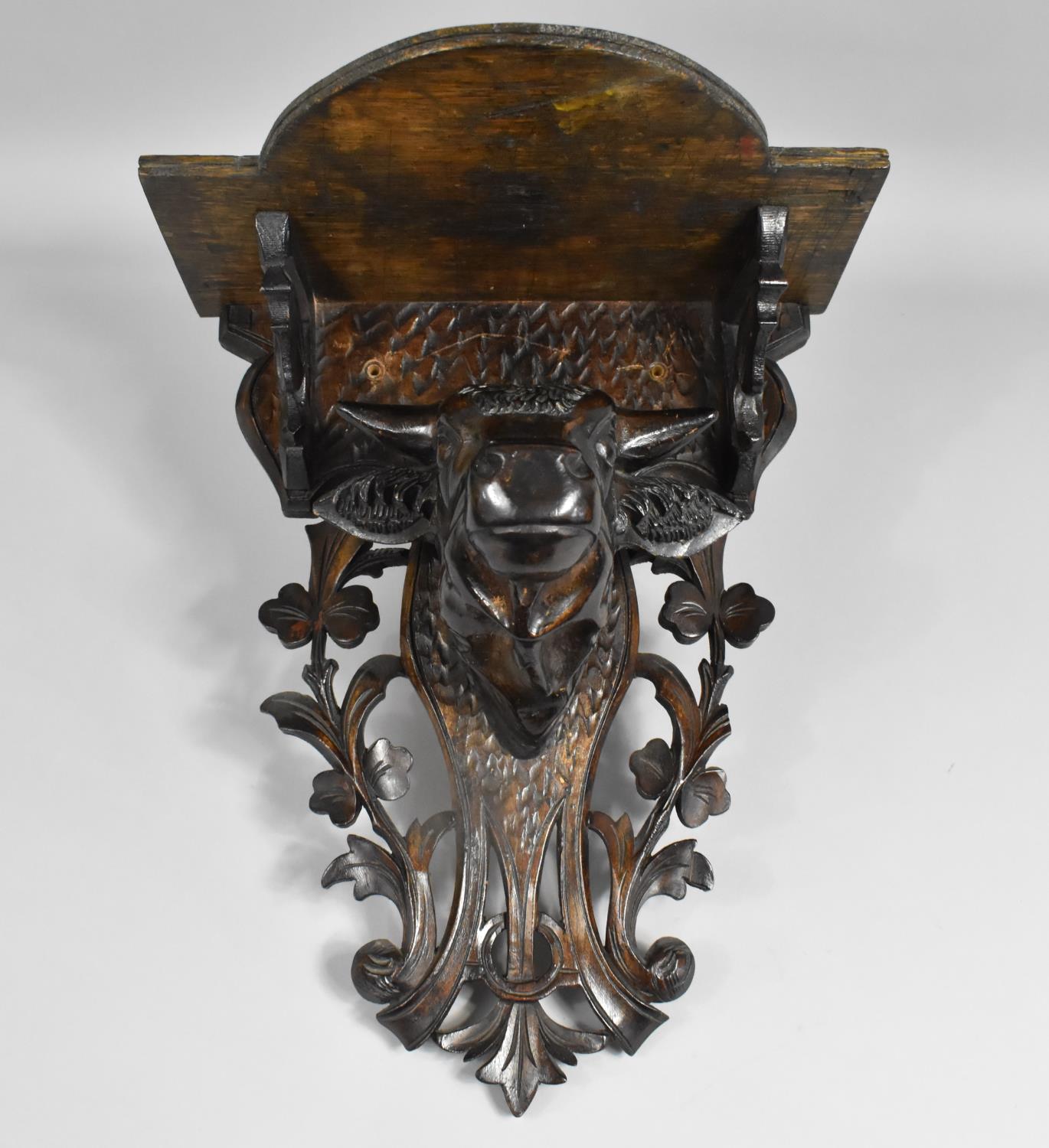 An Early 20th Century Carved Black Forest Wall Shelf with Bulls Head, Pierced Back Plate, 28cms Wide - Image 2 of 4