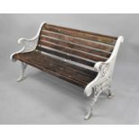 A Wooden Slatted Cast Iron Bench, the Ends of Scrolled Form with Urn and Floral Design, 126cms Wide