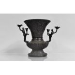 An Oriental Dark Patinated Bronze Vase, The Handles in the Form of Flowers, 18cms High