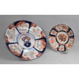 A Large Japanese Imari Charger, decorated with Vase of Flowers and Alternating Trim Cartouches 45.